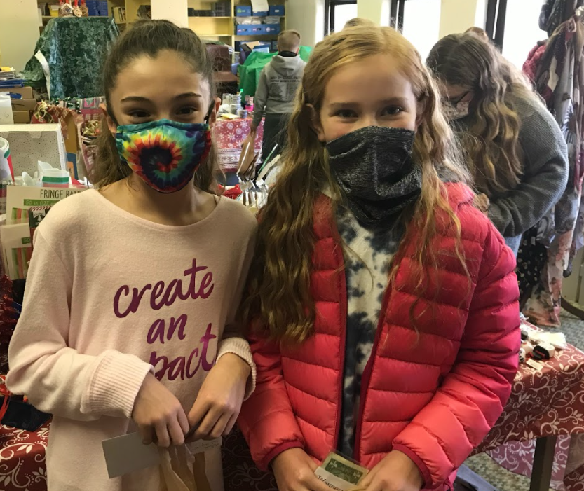 two girls with masks on